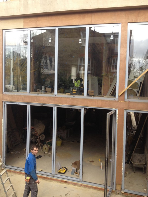 Aluminium bi-fold doors with two-storey glazing in Witney