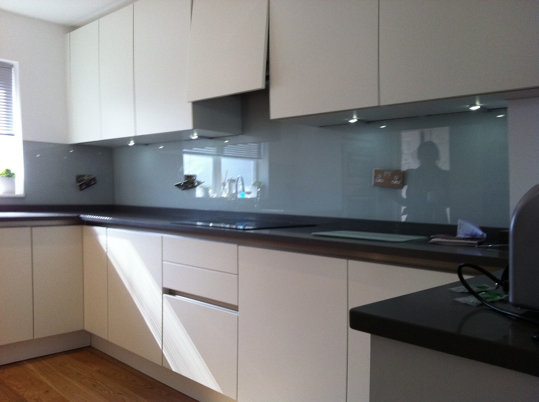 Grey glass kitchen splashback with LED lighting in Witney