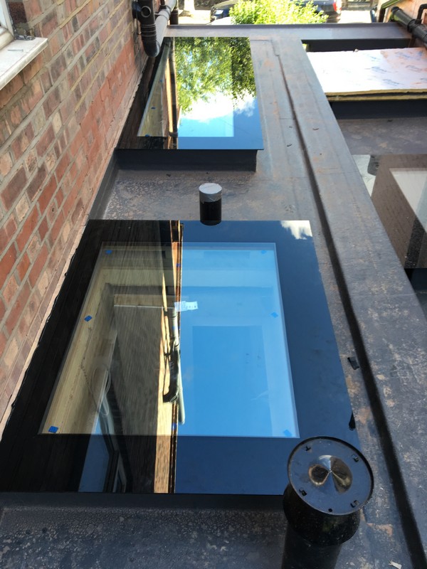 Multiple flat roof skylights on extension in Witney